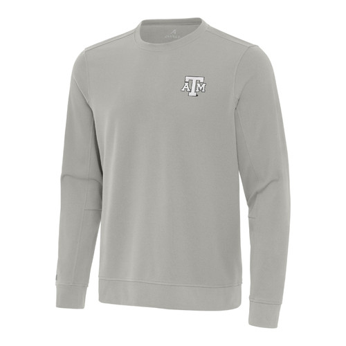 Light gray Antigua Texas A&M long sleeve crewneck pullover featuring a small embroidered A&M logo on the left chest, classic round neckline, ribbed cuffs, and matching waistband.