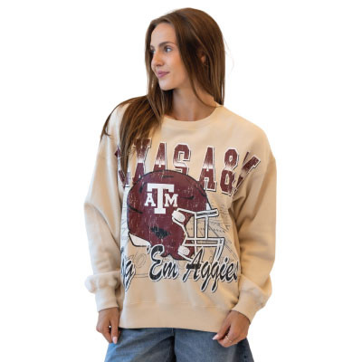 Gameday Social cream Texas A&M crewneck featuring distressed Texas A&M lettering, maroon football helmet, A&M logo, stadium-inspired graphics, Gig ’Em Aggies script, long sleeves, and a relaxed silhouette.