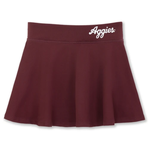 Youth maroon Texas A&M skort featuring a wide waistband with white Aggies script, flared skirt silhouette, clean tonal stitching, and built-in shorts for added coverage during game day activities.