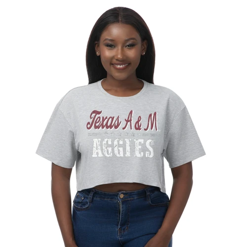 ZooZatz Texas A&M heather gray boxy crop tee featuring short sleeves, a relaxed fit, maroon script Texas A&M lettering, star accents, and distressed white Aggies graphics across the front.