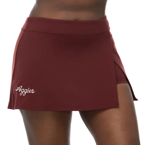 ZooZatz Texas A&M maroon athletic skort featuring a wide waistband, built-in fitted shorts, side slit, and white embroidered Aggies script near the lower hem for a sporty gameday look.