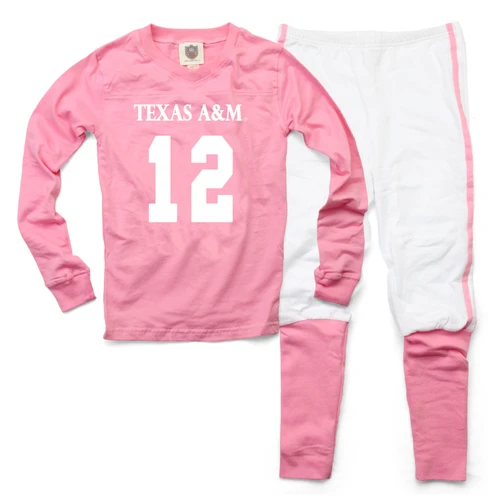 Wes & Willy Texas A&M youth pajama set with a pink long sleeve football jersey-style top featuring white Texas A&M and number 12 graphics, paired with white pants with pink accents.