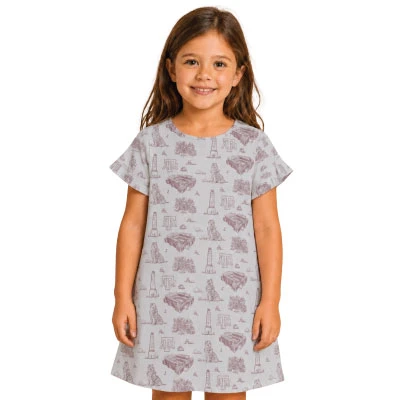 Stewart Simmons youth Texas A&M dress featuring a light gray A-line silhouette with short sleeves and an allover maroon toile-style print of Reveille, Kyle Field, A&M logos, and Aggieland landmarks.