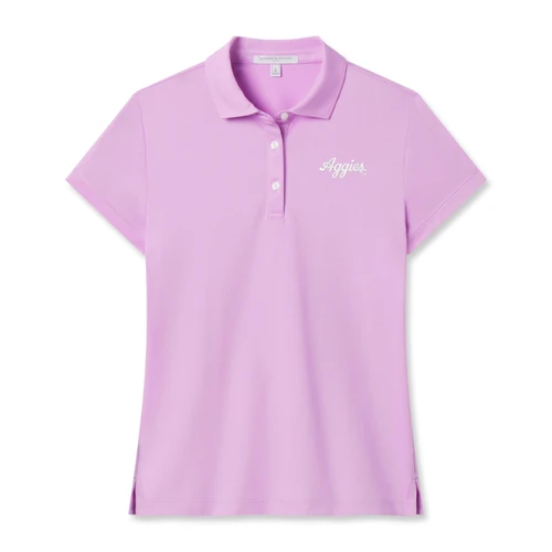 Fairway & Greene women’s Texas A&M polo in soft pink featuring short sleeves, a classic collar, three-button placket, side vents, and white embroidered Aggies script on the left chest.