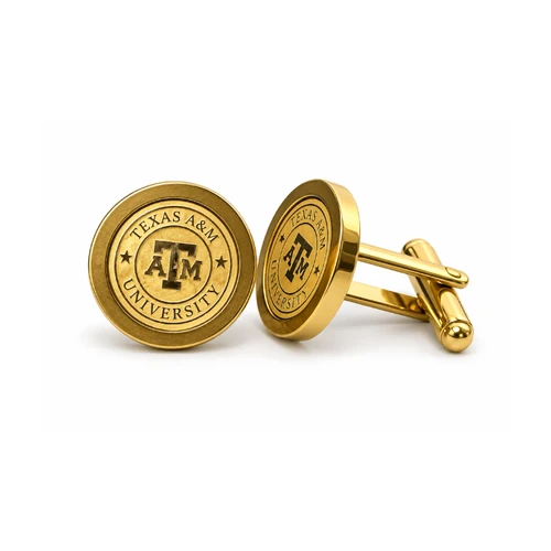 Round gold-tone Texas A&M University cufflinks featuring a raised A&M logo, engraved Texas A&M University lettering, decorative stars, polished circular edges, and gold-tone bullet-back closures.