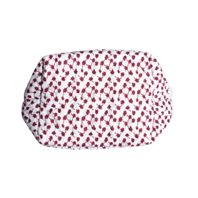 Ida Mae quilted travel case featuring an allover maroon floral print on a white background, zippered closure, spacious rectangular design, and soft construction for storing cosmetics, toiletries, and travel essentials.