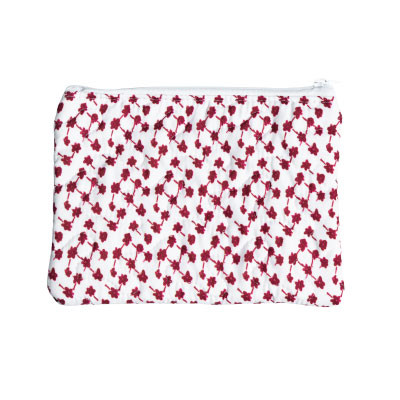 Ida Mae small travel case featuring an allover maroon floral print on a white background, zippered closure, compact rectangular shape, and quilted construction for organizing cosmetics, toiletries, and small travel essentials.
