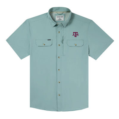 Light blue Poncho short sleeve fishing shirt featuring an embroidered Texas A&M logo on the left chest, button-front closure, dual chest pockets, and lightweight performance fabric for outdoor wear.