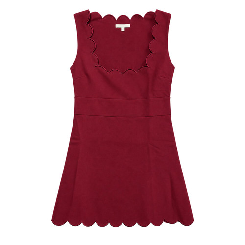 Maroon sleeveless mini dress featuring a decorative scalloped neckline with matching piping, wide fitted waistband, gently flared A-line skirt, and scalloped hemline for a feminine, polished game day look.
