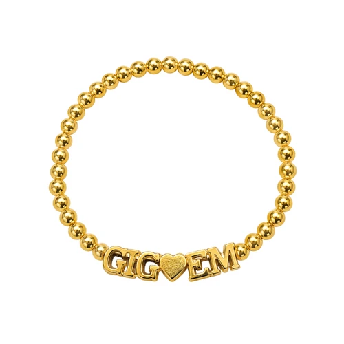 Gold-tone Color Shout Texas A&M bracelet featuring polished round beads arranged in a circular strand with a bold GIG heart EM centerpiece, combining shiny metallic details with a spirited Aggie-inspired design.
