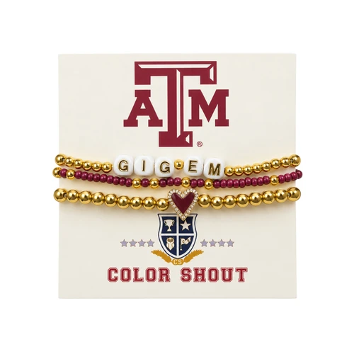 Color Shout Texas A&M three-pack bracelet set featuring gold-tone beads, maroon accent beads, white GIG 'EM letter beads, and a maroon heart charm outlined with sparkling stones, displayed on branded packaging.