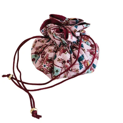 Saturday Silks Texas A&M jewelry pouch featuring a colorful Aggieland-inspired print with A&M logos, western motifs, stars and florals, finished with maroon piping, drawstrings, and gold-tone accents.
