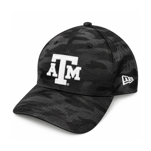 New Era Texas A&M snapback cap featuring a black and charcoal camouflage pattern, white embroidered A&M logo on the front, curved bill, perforated side panels, and adjustable black snapback closure.