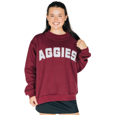 Scarlet & Gold maroon Aggies mockneck sweatshirt featuring bold textured AGGIES lettering across the chest, a raised mock neckline, long sleeves, and ribbed cuffs and hem for a classic collegiate look.