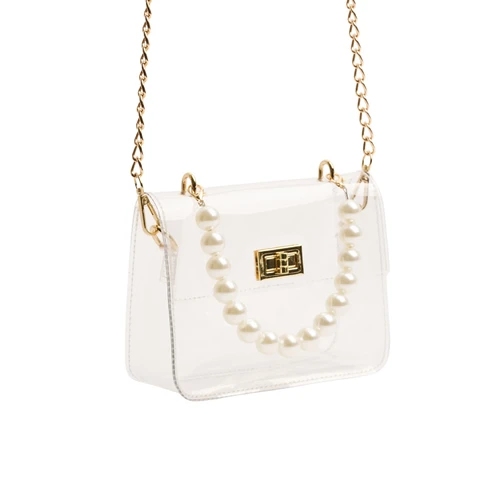 Clear structured handbag featuring a pearl top handle, removable gold-tone chain shoulder strap, flap front, and polished gold turn-lock closure for an elevated game day or event-ready look.