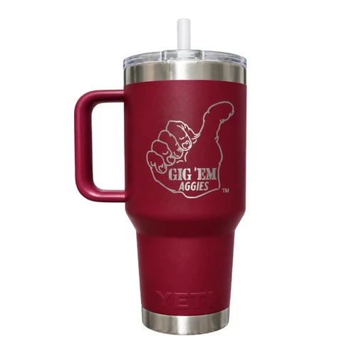 Maroon Texas A&M YETI 35 oz straw tumbler featuring a silver Vault Gig 'Em thumbs-up hand logo with "Gig 'Em Aggies" lettering, matching maroon handle, clear lid, white straw, and stainless steel accents.