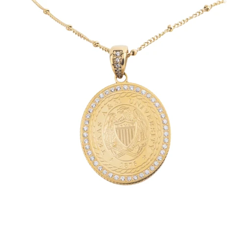 A Wink of Yellow gold-tone Texas A&M necklace featuring an oval University seal pendant surrounded by clear sparkling stones, with additional stone accents on the bail and a delicate adjustable chain.