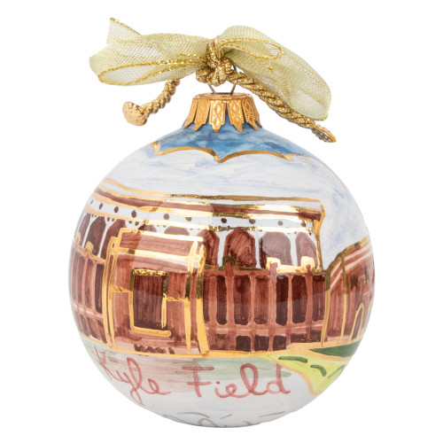 Hand painted Kitty Keller ornament featuring Kyle Field with detailed stadium artwork, a gold bow topper, and Texas A&M Aggies design in maroon and white.