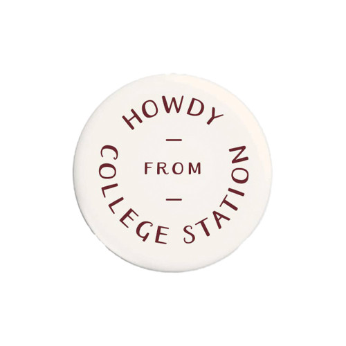 Round cream Texas A&M button featuring maroon “Howdy From College Station” text arranged in a circular design, perfect for Aggies fans to wear on backpacks, jackets, or game day outfits.