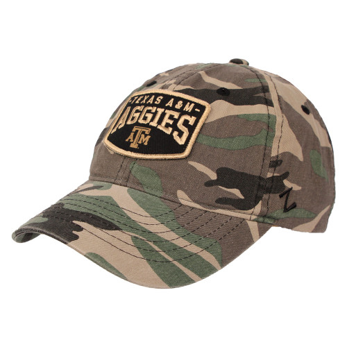 Camo Zephyr Texas A&M hat featuring a black and gold embroidered Aggies patch on the front, styled as a rugged and spirited game day cap for Aggies fans.