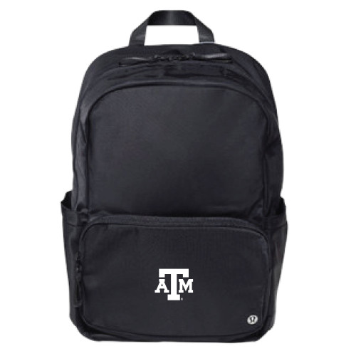 lululemon Everywhere backpack in black with front zip pocket, side pockets, and Texas A&M logo on the front