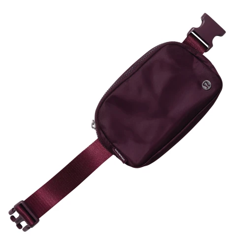 lululemon Everywhere belt bag in maroon with adjustable strap and zip closure