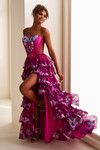 Ellie Wilde EW37001 front in Magenta/Multi—tiered ruffles flowing with high slit.
