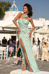 Mint PS26011 3D floral fitted gown with slit and rosette choker, outdoor plaza view.