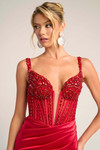 Close-up of red PS26046 corset bodice showing intricate hand-beaded detail and sculpted cups.