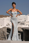 Model wearing PS26175 blue lace gown with sweetheart neckline and thigh-high slit outdoors.
