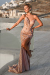 Model posing outdoors in PS26221 rose gold variation with embellished florals and high slit.