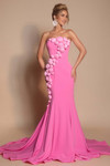 Model wearing the pink PS26305E evening gown with cascading 3D rosettes, front view.