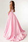 Pink matte satin ballgown shown from a back angle with full flowing skirt.