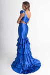 Rachel Allan 70976 Royal — studio side-back view capturing oversized shoulder bow and cascading layered ruffle train.