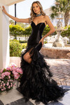 Rachel Allan 70938 Black — outdoor three-quarter back view on steps showing high-low organza tiers.