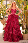 Model wearing a wine tiered ruffle A-line prom dress with a sweetheart strapless bodice and shimmering sequin lace.