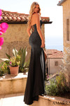 Back view of black beaded gown with lace-up back and fitted silhouette.