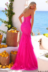 Back view of the fuchsia lace mermaid gown showing lace-up back and flared tulle train.