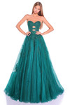 Model wearing an emerald lace and tulle A-line prom dress with keyhole cut-outs and full skirt.