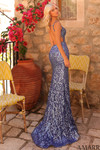 Back view of the slate blue sequin gown featuring a fully open back and flared hem.