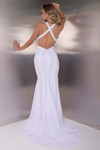 Back view of the white Jasz Couture 7903 showing the open back and crossover strap detailing.