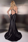 Back view of Jasz Couture 7903 in black showing the open low back and crisscross halter straps.