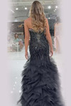 Jasz Couture 7905 in Black/Gunmetal back view displaying starburst beadwork and tiered ruffles