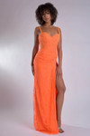 Model in orange Jasz Couture 7913 highlighting the lace texture, supportive straps, and thigh-high slit.