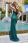Back view of the emerald gown showing the straight-across back and shimmering beaded mesh.