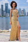 Model wearing a gold fully beaded sheath gown with a plunging strapless cat-eye neckline and high slit.