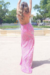 Back view of Jasz Couture 7977 in hot pink showing open back with criss-cross straps.