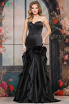 Colors Dress 3880 in Black with dramatic mermaid silhouette and oversized rosettes.