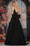 Colors Dress 3922 in Black with a low V-back, oversized bow detail, and regal ball gown silhouette.