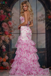 Colors Dress 3928 in Pink with a fitted mermaid silhouette, mid-open zipper back, and dramatic ruffle detailing.